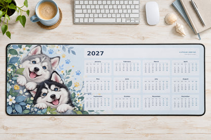 Happy Huskies 2027 calendar desk mat – illustrative printed product mockup