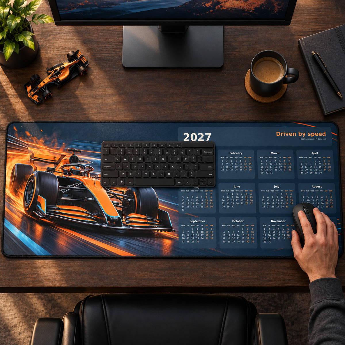 Papaya Pulse 2027 calendar desk pad in use with a computer mouse on a styled desk.