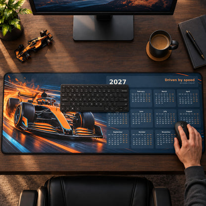 Papaya Pulse 2027 calendar desk pad in use with a computer mouse on a styled desk.