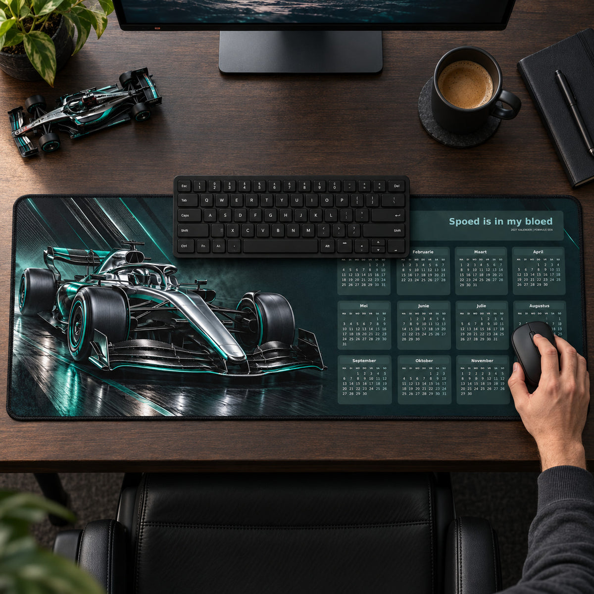 Carbon and Chrome 2027 calendar desk pad in use with a computer mouse on a styled desk.
