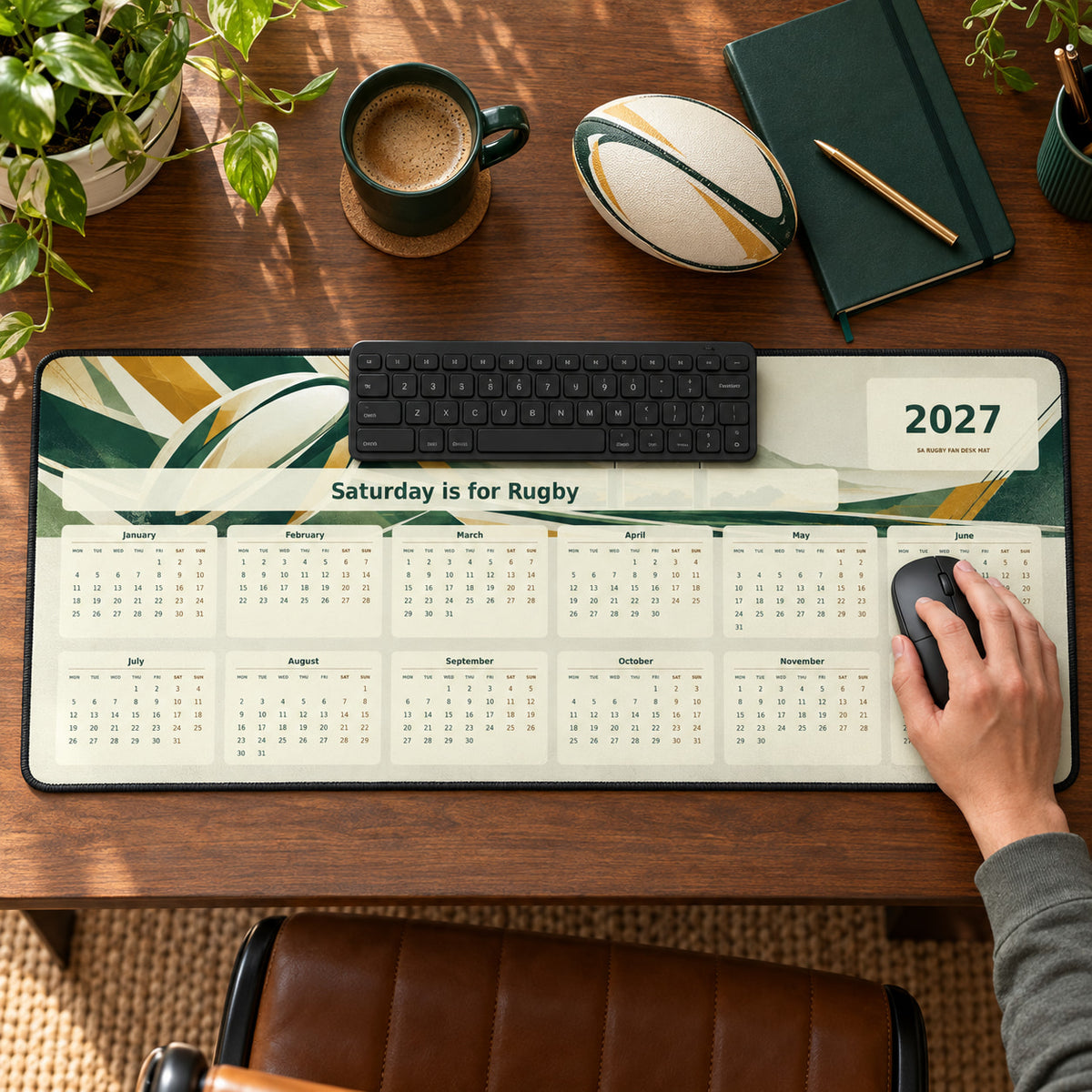 Modern Rugby Geometry 2027 calendar desk pad in use with a computer mouse on a styled desk.