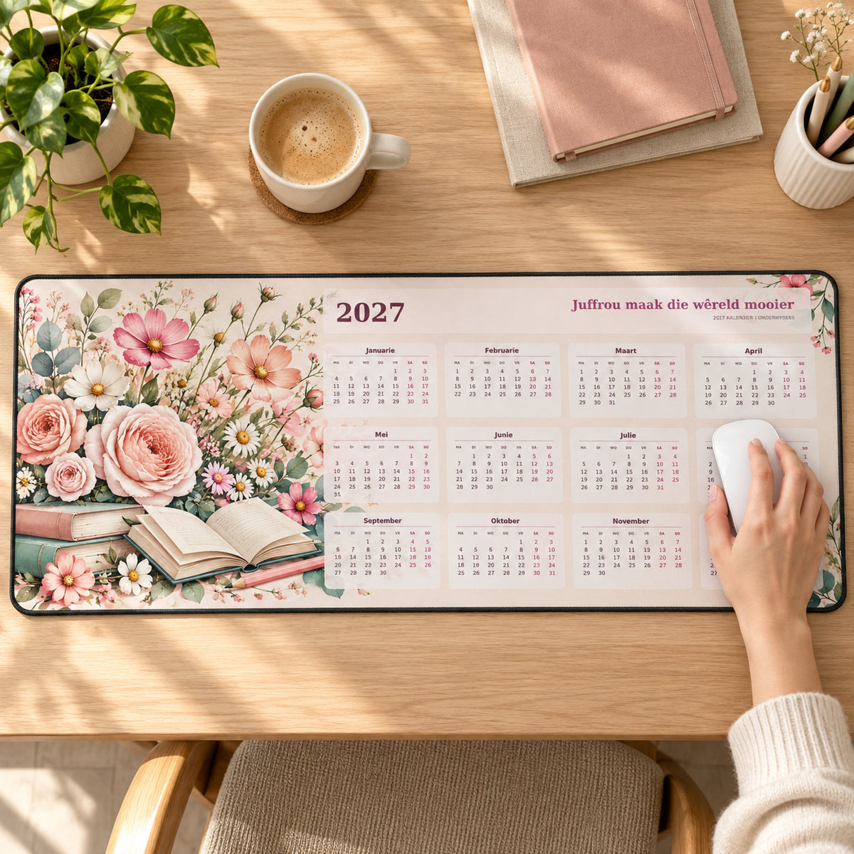 Juffrou Flower Garden 2027 calendar desk pad in use with a computer mouse on a styled desk.