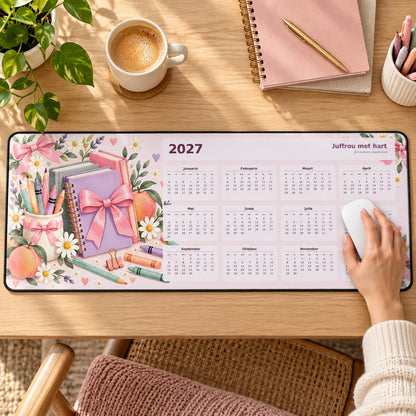 Pastel Juffrou 2027 calendar desk pad in use with a computer mouse on a styled desk.
