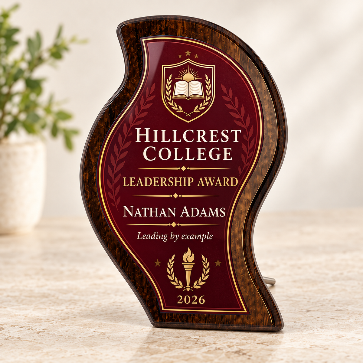 Curved flame wood and glass school leadership award in burgundy and gold